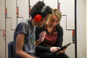 Image of two people using a speech device